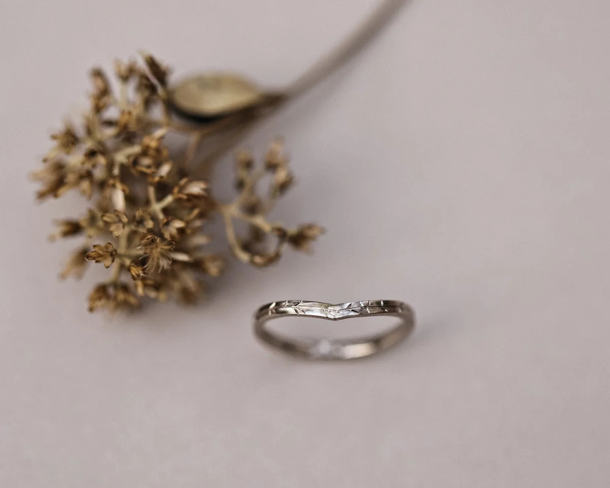 Front view of 18ct white gold willow leaf engraved wishbone ring