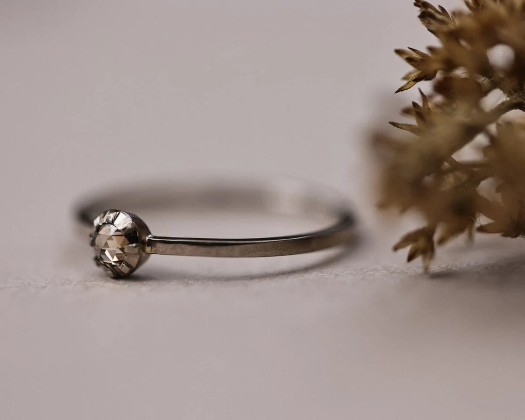 Close-up of champagne rose-cut diamond ring in 18ct white gold