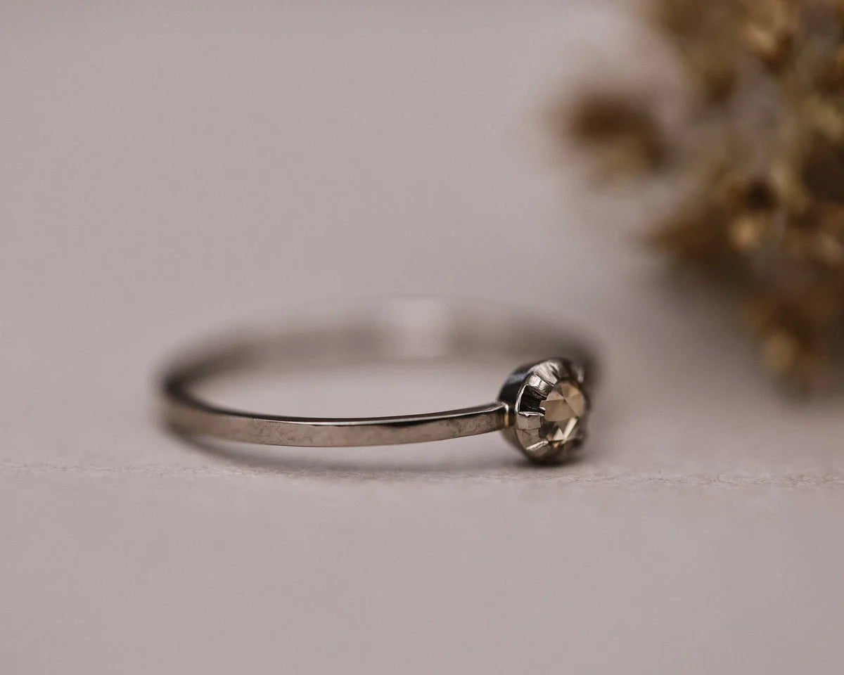 Low side profile of champagne rose-cut diamond ring with plain band