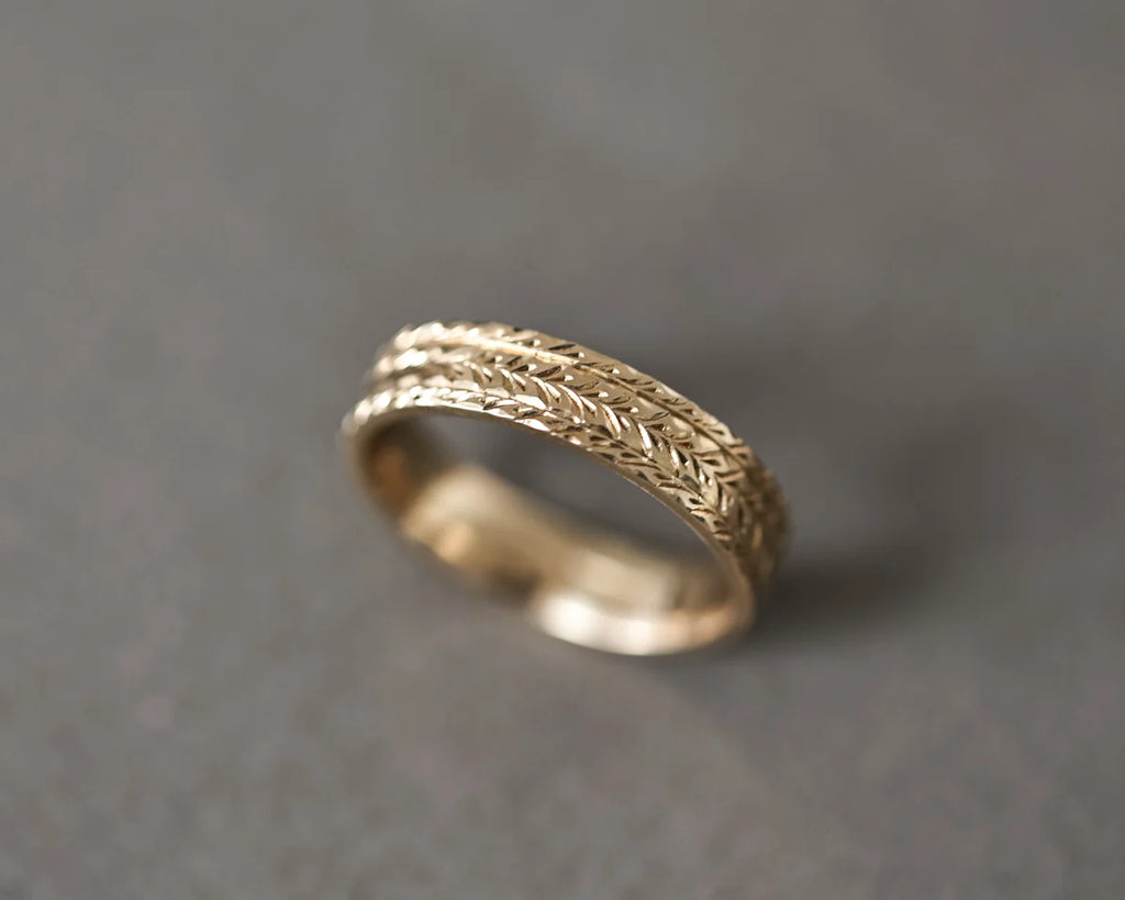 linear herringbone pattern detail gold engraved ring