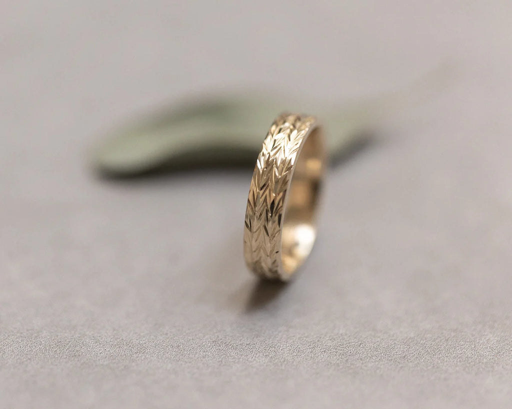 linear herringbone pattern detail gold engraved ring