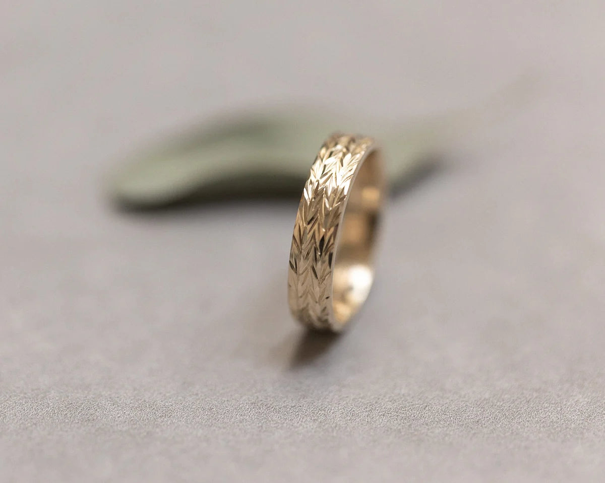 linear herringbone pattern detail gold engraved ring