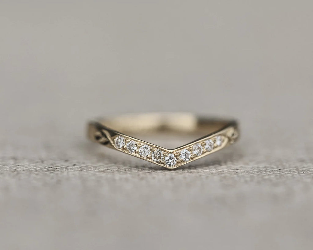 Front view of white gold diamond wishbone ring with pavé setting