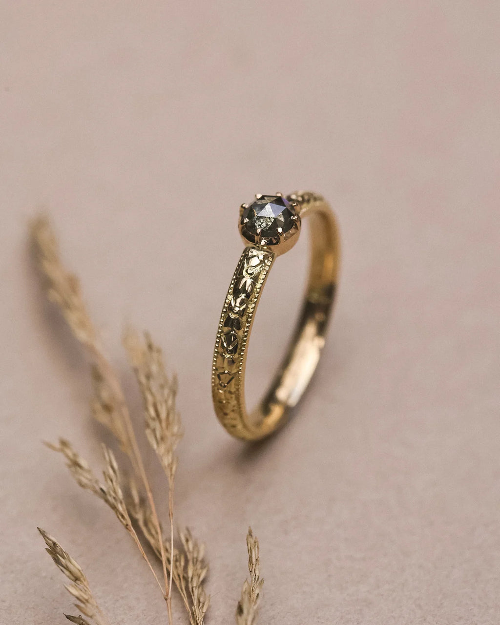 Editorial close-up of 18ct yellow gold orange blossom diamond ring
