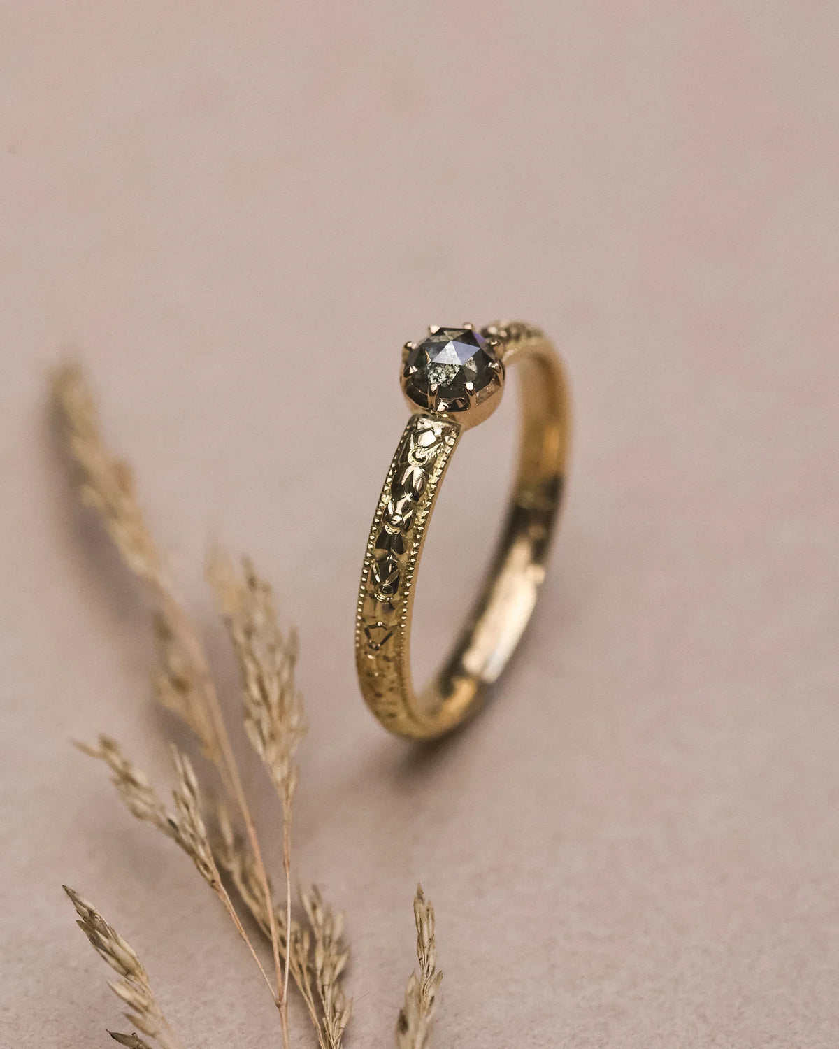 Editorial close-up of 18ct yellow gold orange blossom diamond ring