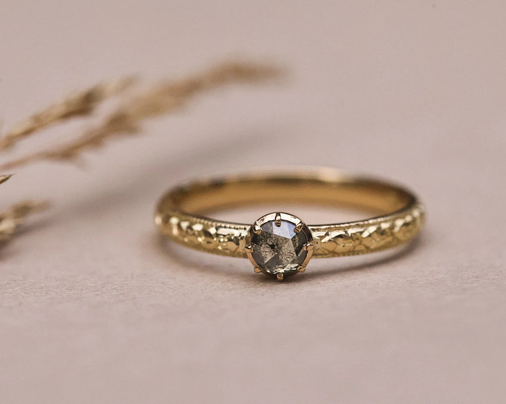 Front view of grey rose-cut diamond ring in 18ct yellow gold