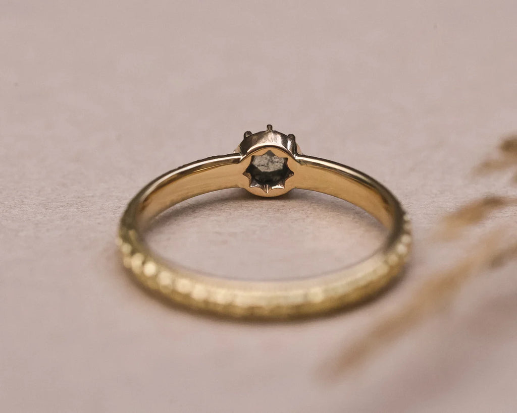 Rear view of handmade grey diamond ring showing orange blossom engraving