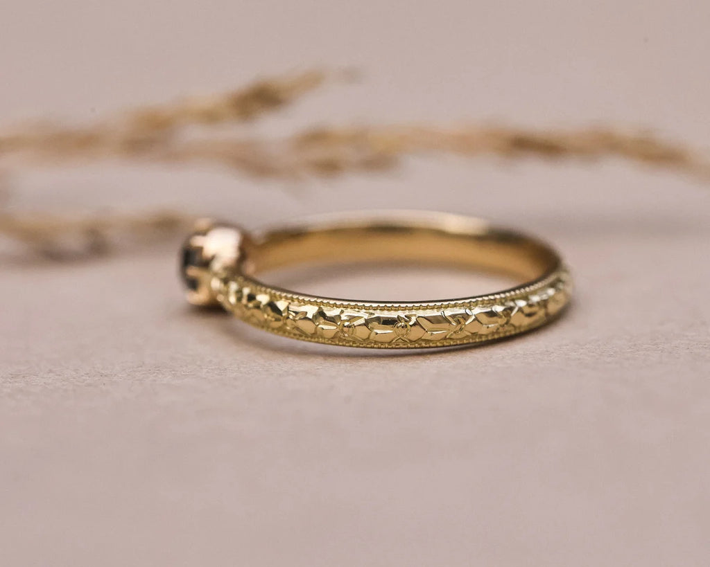 White gold version of orange blossom engraved ring with grey rose-cut diamond