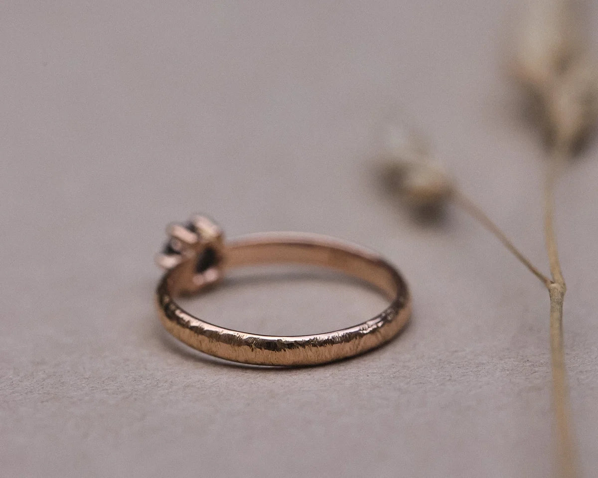 Rear profile of handmade rose gold ring showing horn texture finish