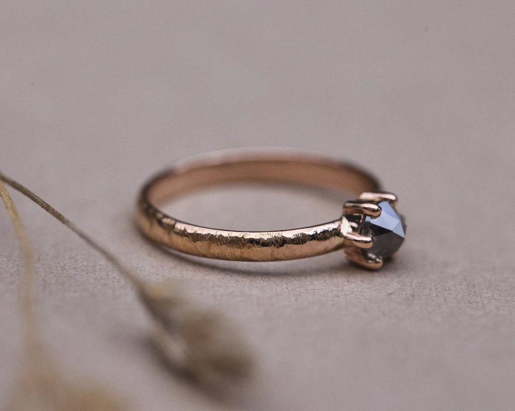 Side view of organic horn texture ring with natural grey rose-cut diamond