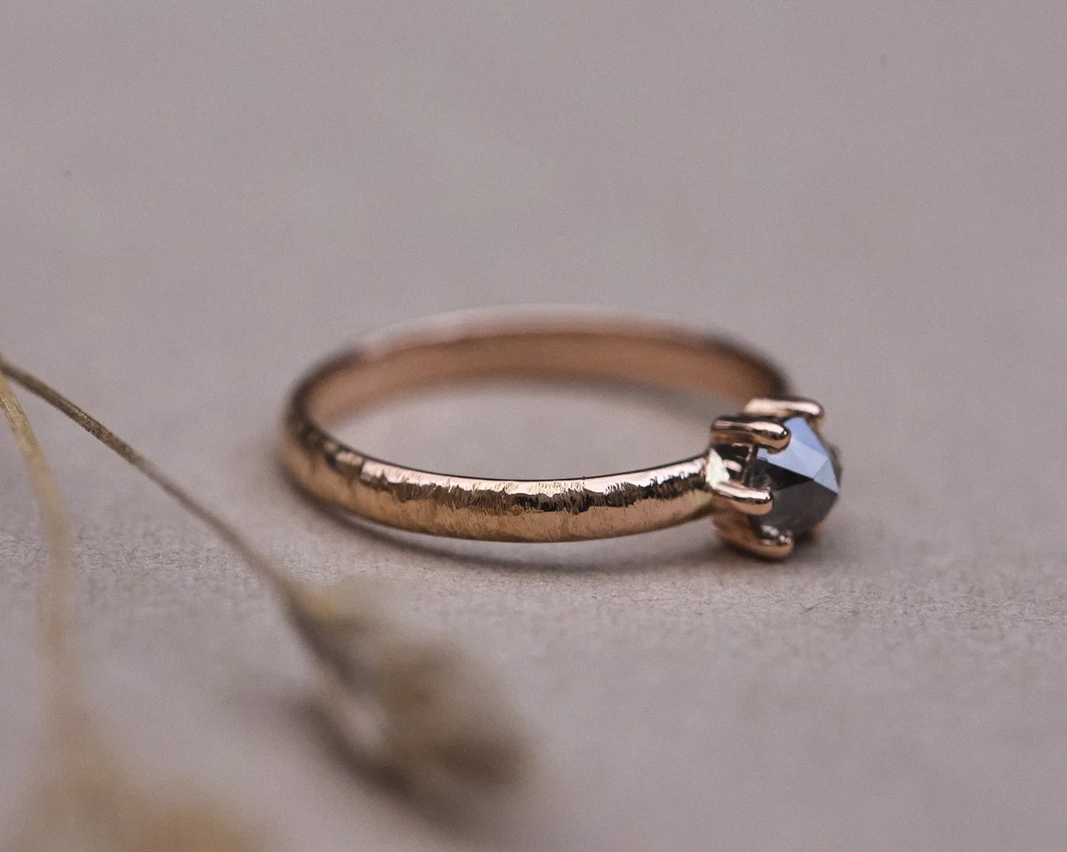 Side view of organic horn texture ring with natural grey rose-cut diamond