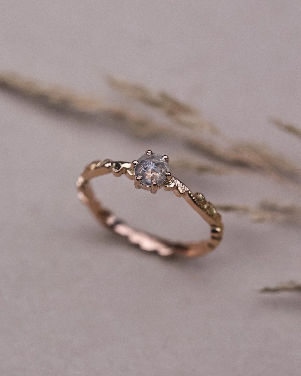 Soft focus view of one-of-a-kind rose-cut diamond floral ring