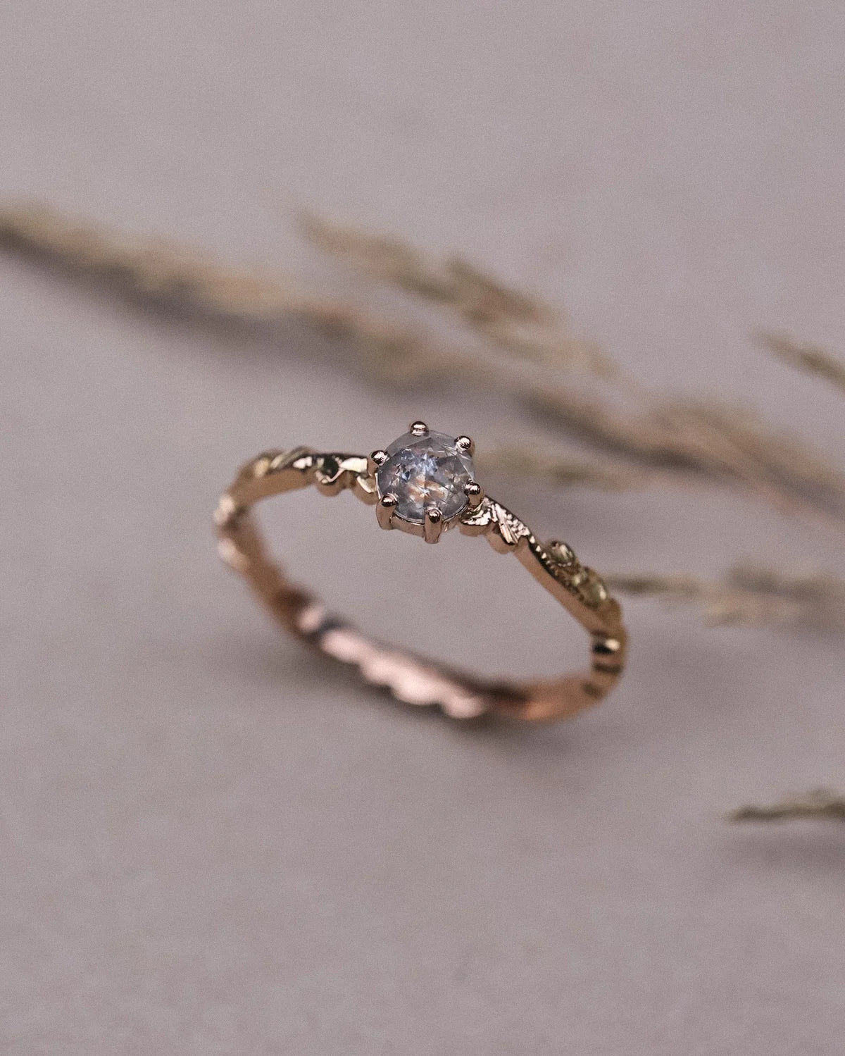 Soft focus view of one-of-a-kind rose-cut diamond floral ring