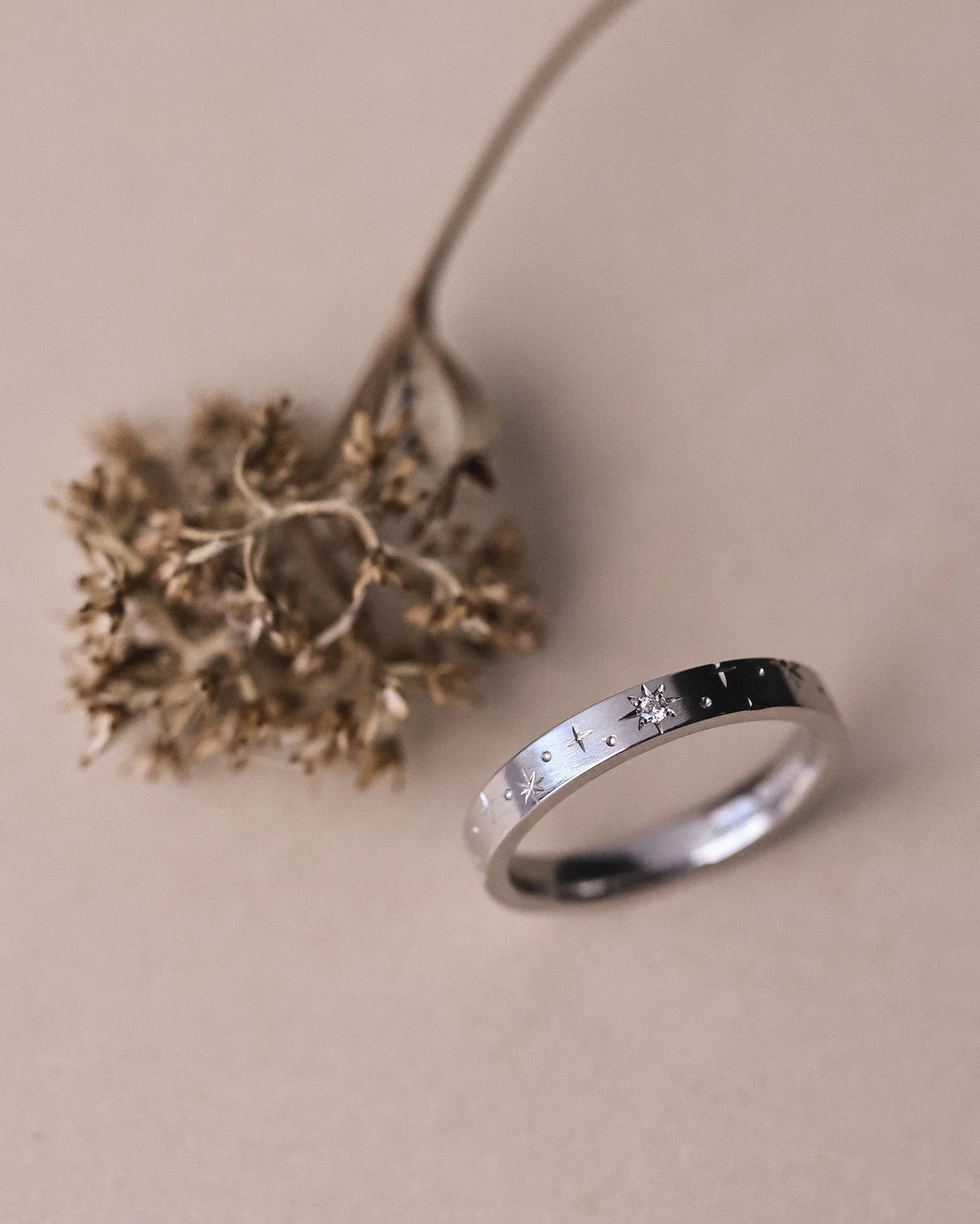 Angled view of handmade platinum star set diamond ring
