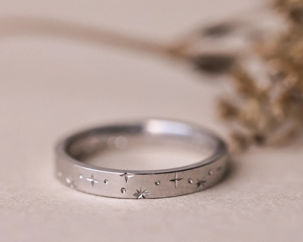 Front view of 3mm platinum eternity ring with engraved star motif