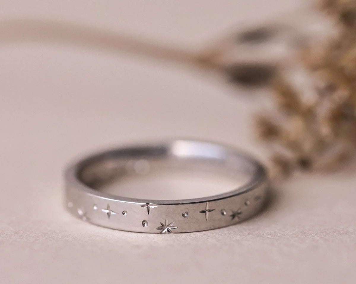 Front view of 3mm platinum eternity ring with engraved star motif