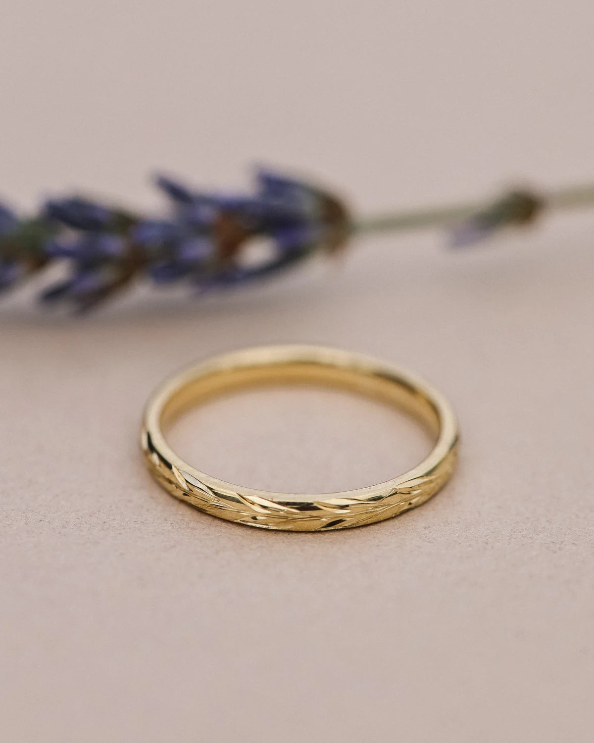 Front view of 18ct yellow gold olive leaf engraved wedding ring