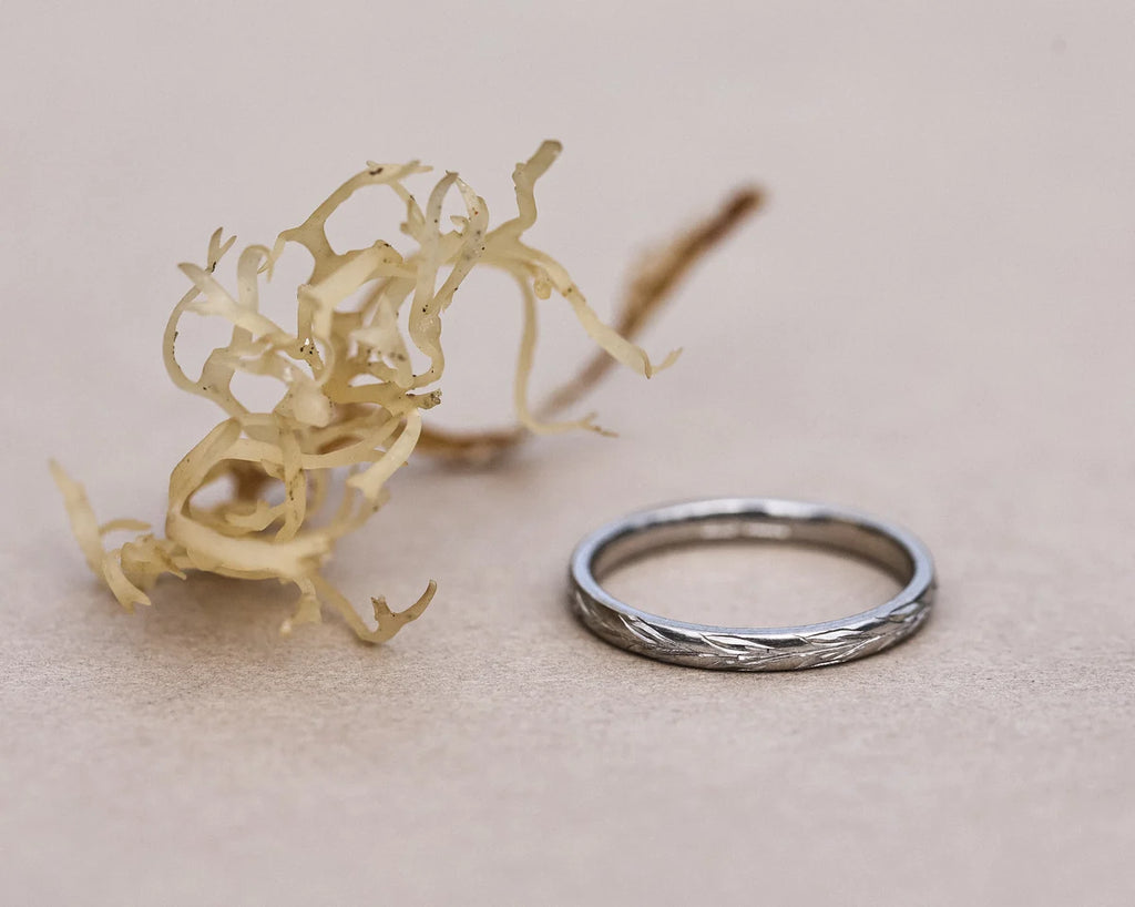 Low front view of platinum olive leaf wedding band