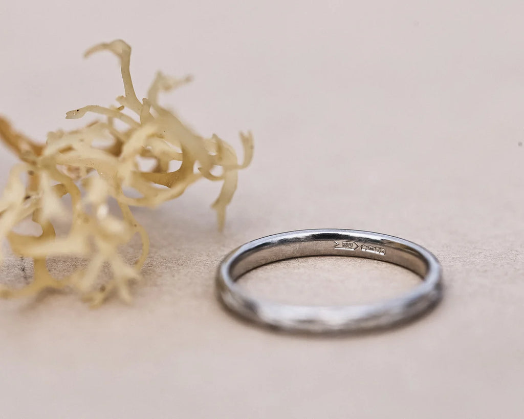 Minimal platinum olive leaf engraved wedding ring with natural styling