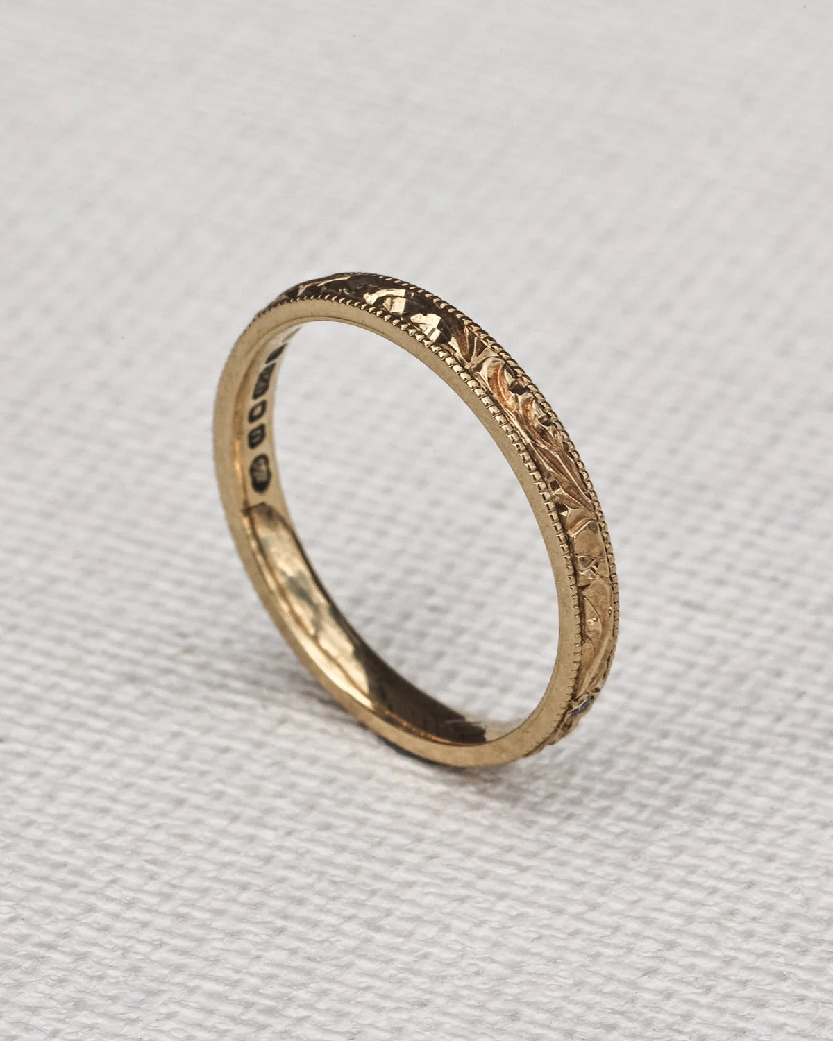 delicate gold wedding band floral leaf engraving minimalist design