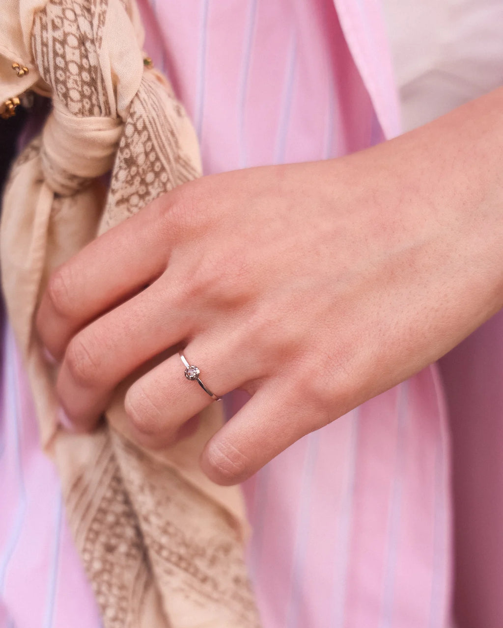 Champagne rose-cut diamond ring worn on hand in editorial styling