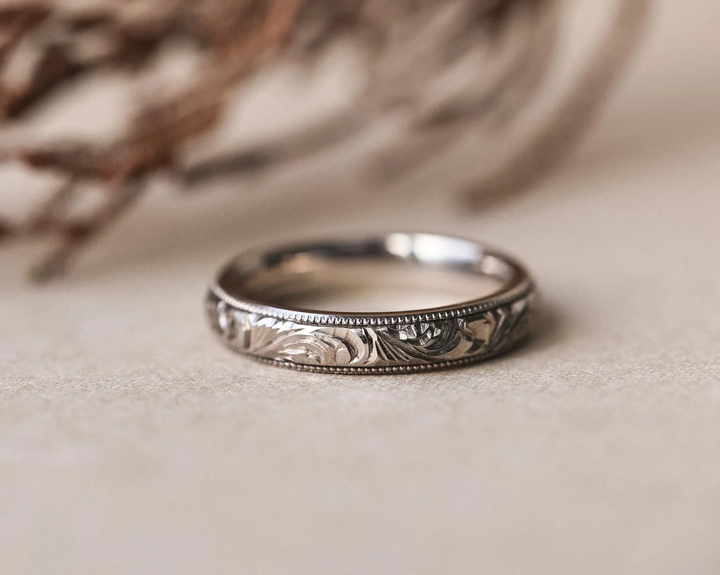 Front view of 4mm floral engraved ring with fine milled edge
