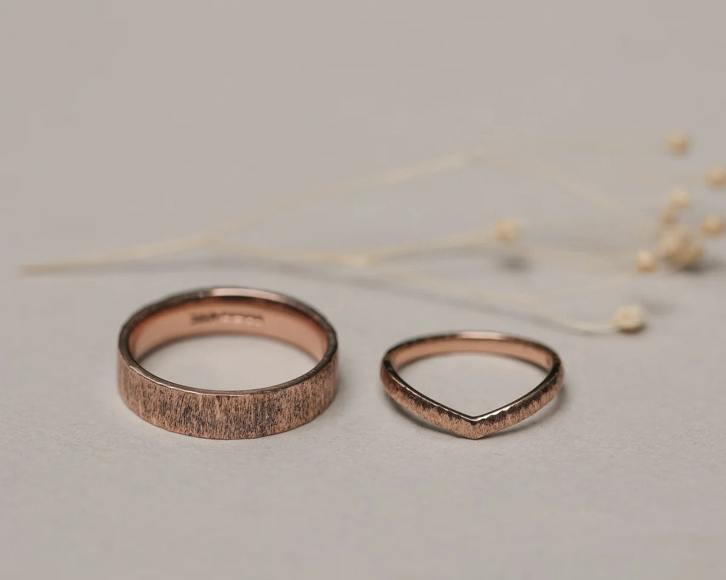 Rose gold horn texture wedding ring paired with curved wedding band