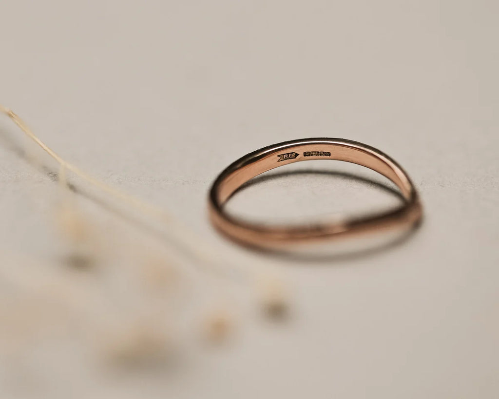 Back view of 18ct rose gold wishbone ring with smooth interior