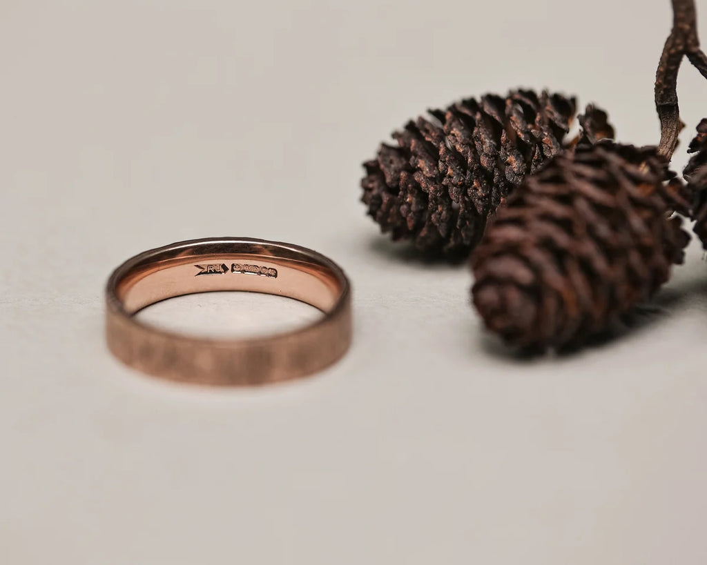 Back view of 9ct rose gold flat court wedding ring with smooth interior