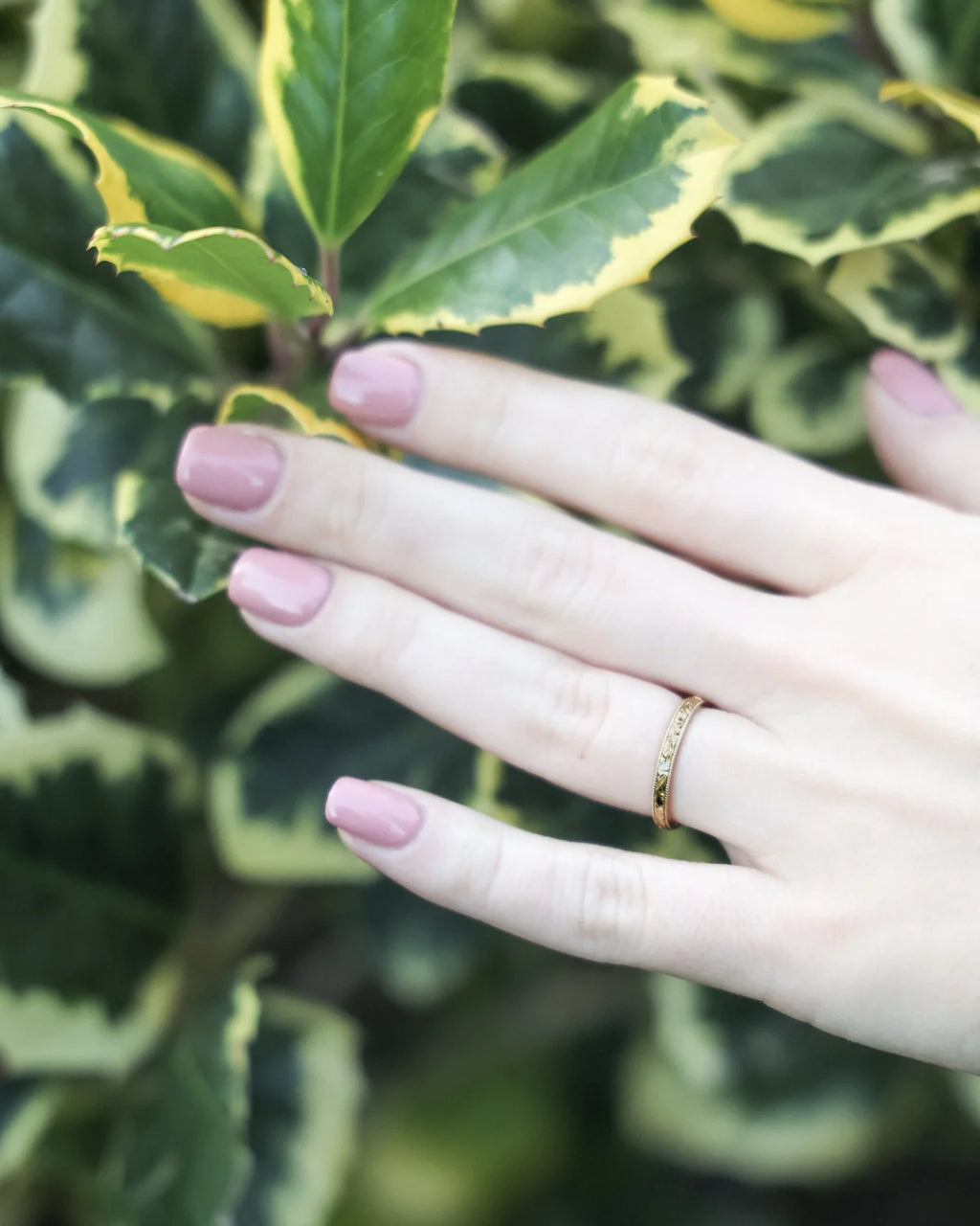 gold wedding ring worn on hand 2mm floral leaf engraved band