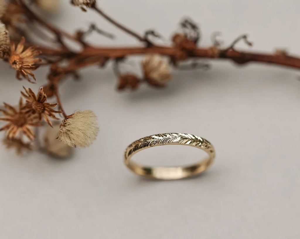 Front view of 2mm yellow gold laurel leaf engraved wedding band