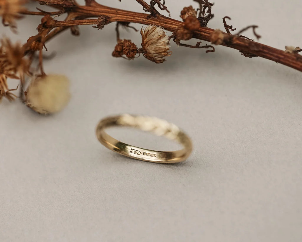 Back view of handmade yellow gold laurel leaf wedding ring