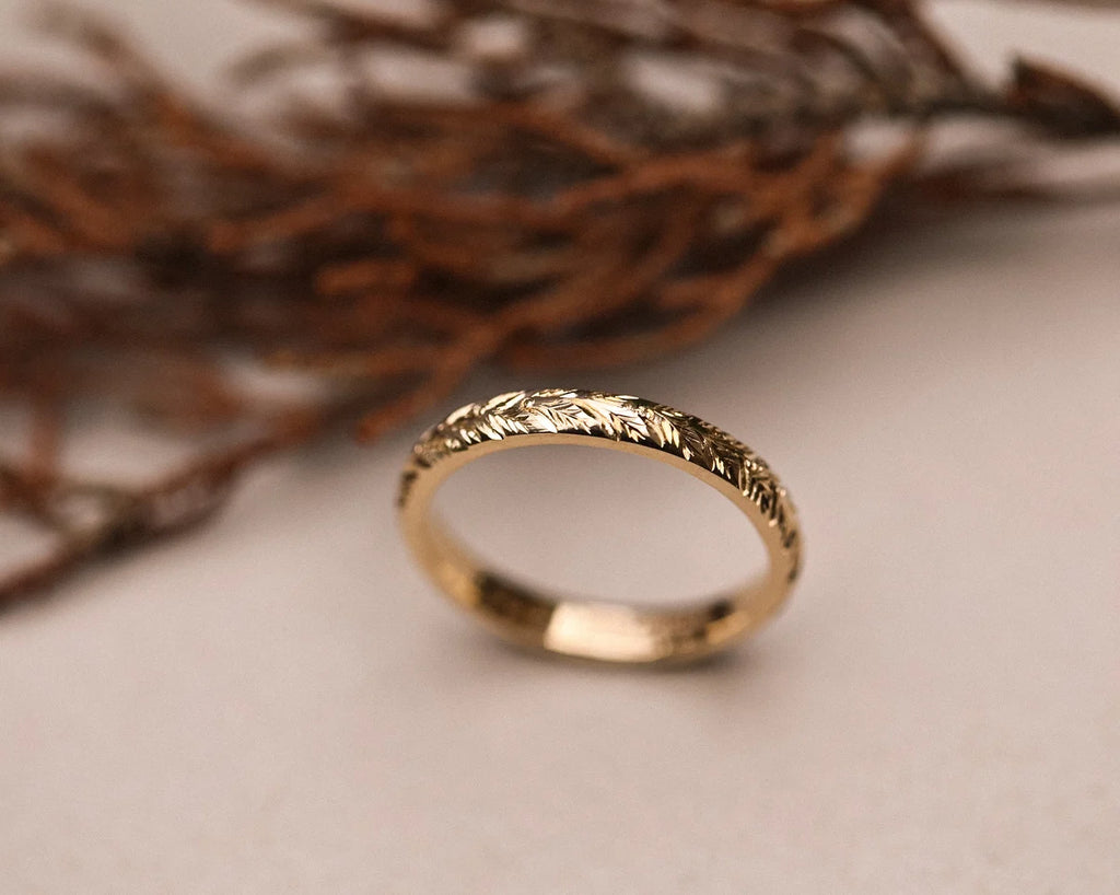Front view of hand engraved laurel leaf ring in 9ct gold