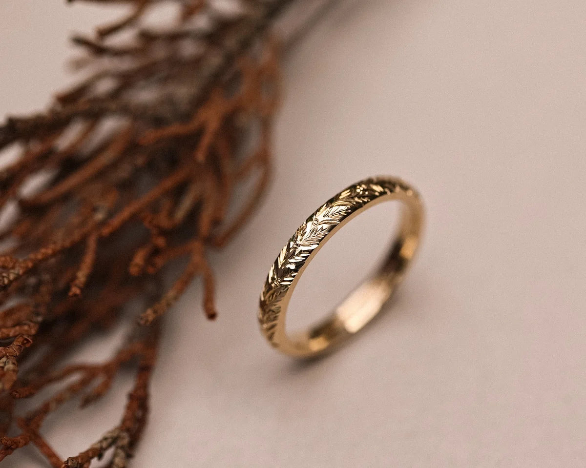 Side view of 9ct gold laurel leaf engraved wedding band