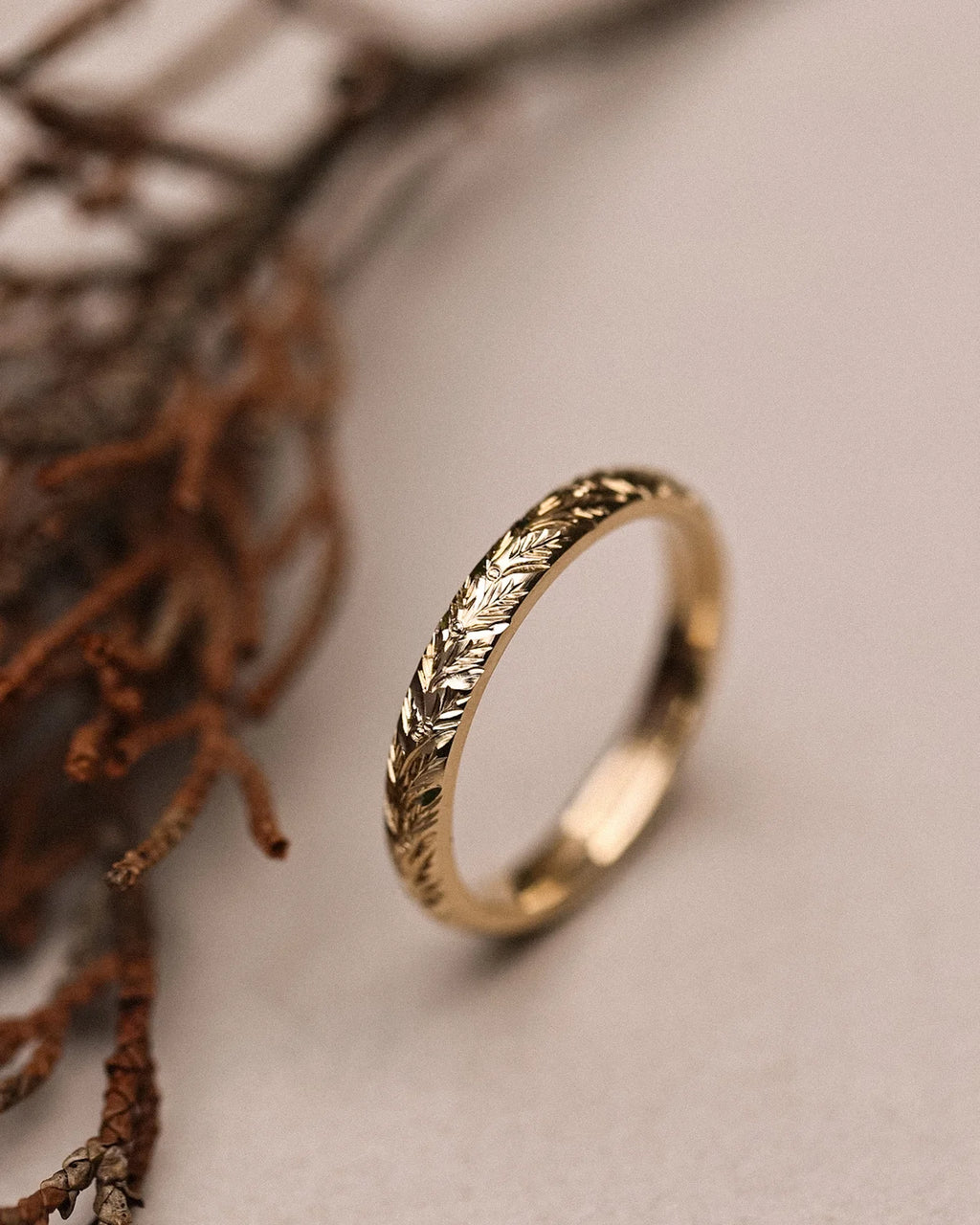 Vertical view of laurel leaf engraved ring in 9ct yellow gold