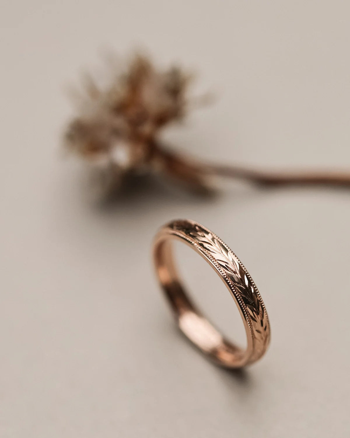 Side profile of rose gold olive leaf wedding ring