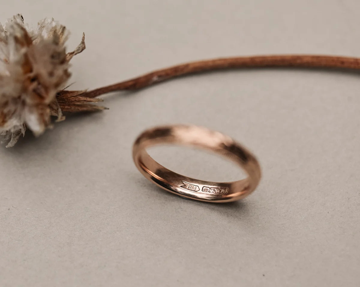 Minimal 18ct rose gold wedding ring with olive leaf engraving