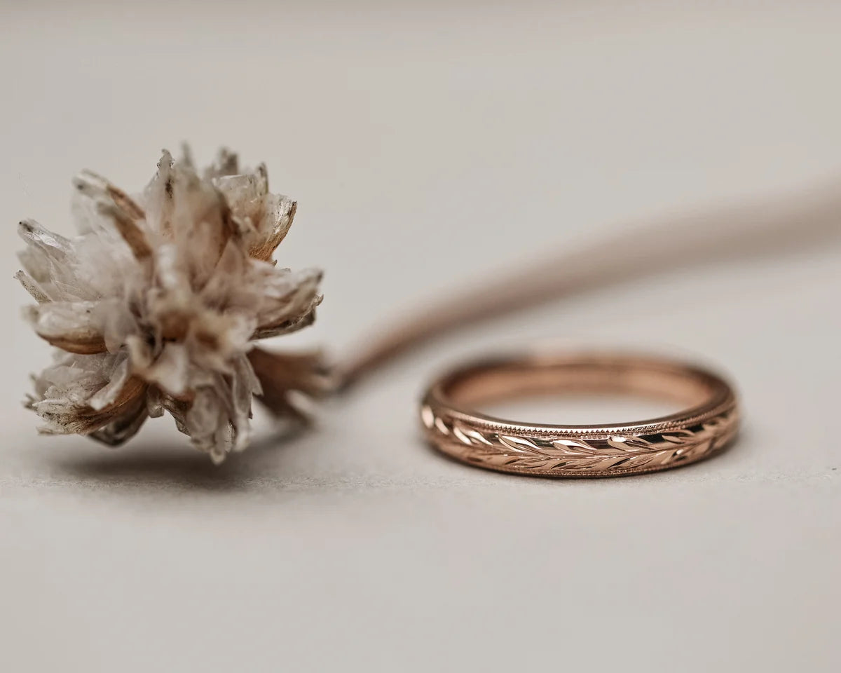 18ct rose gold olive leaf ring styled with dried botanical detail