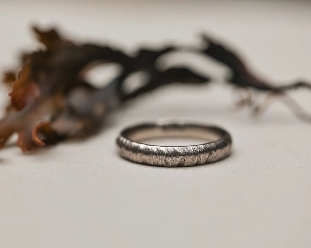 organic textured finish white gold band ring detail