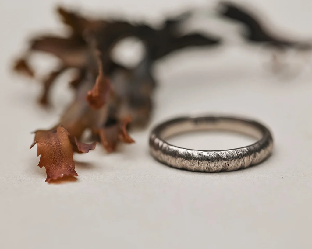 organic textured finish white gold band ring detail