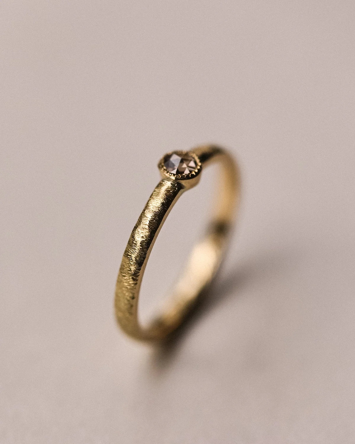 Side profile of one-of-a-kind champagne diamond horn texture ring