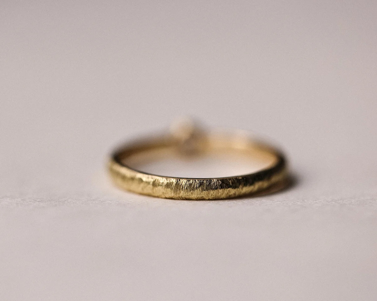 Back view of handmade yellow gold horn texture ring