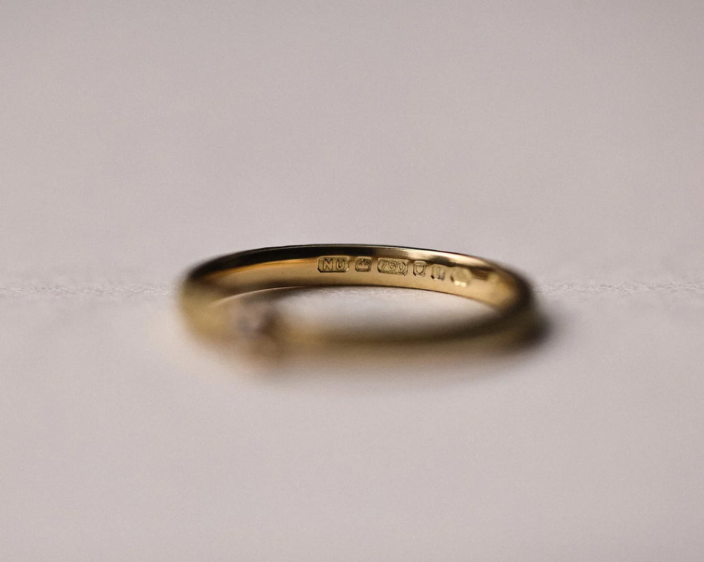 Low side profile of champagne diamond ring with textured gold band