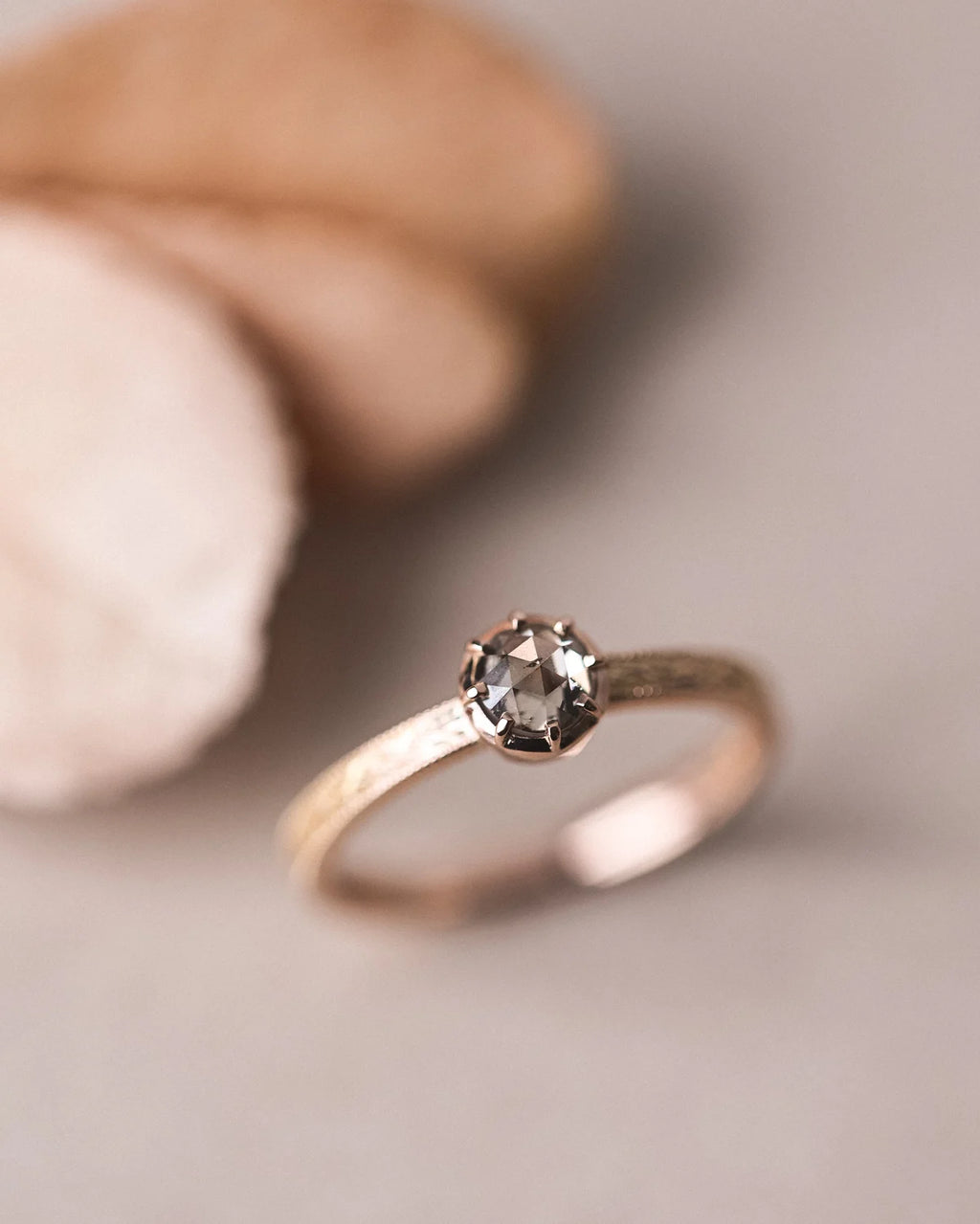 Editorial image of 18ct rose gold laurel ring with brown-grey diamond