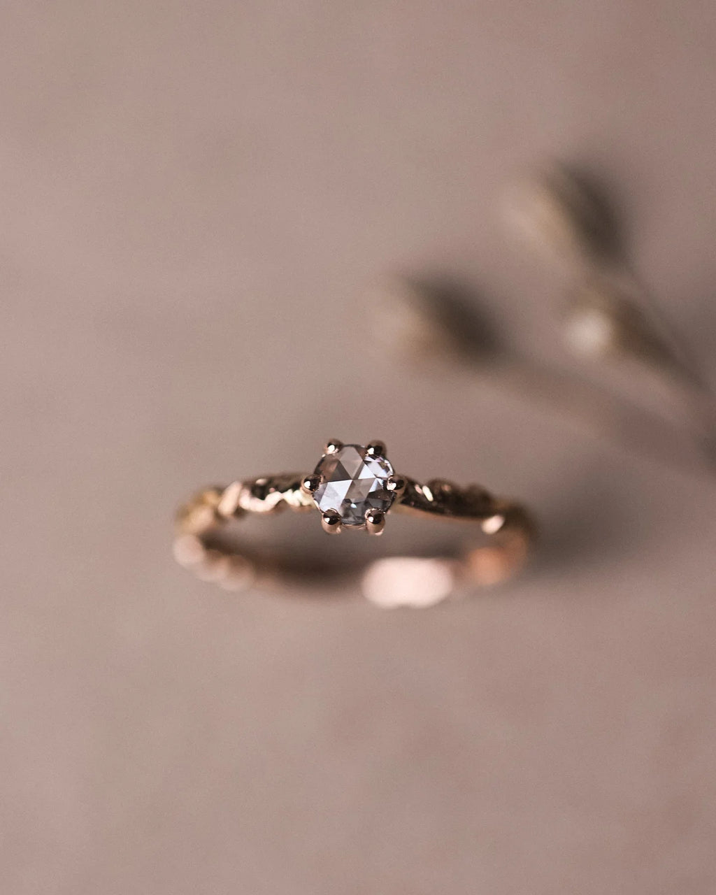 Editorial close-up of 18ct rose gold rose-cut diamond ring