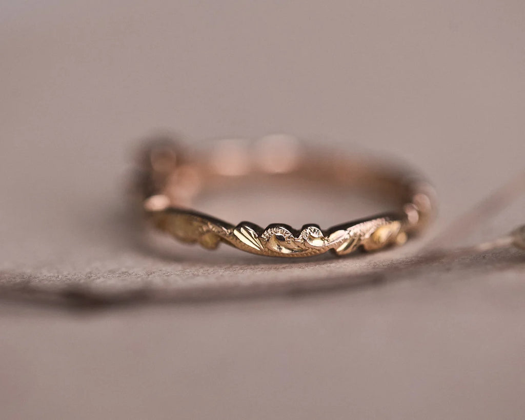 Close-up of carved floral band with rose-cut diamond setting