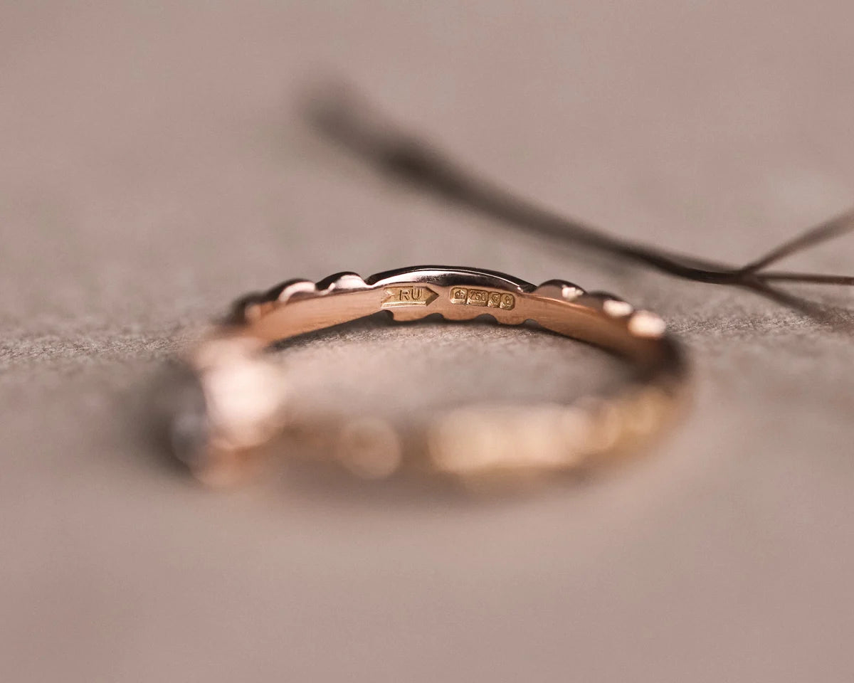 Back view of 18ct rose gold floral carved band
