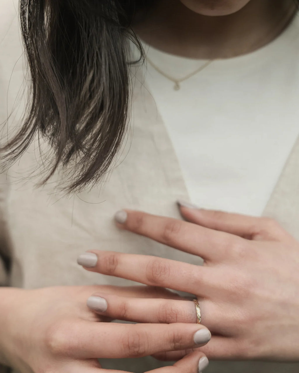 Olive leaf engraved yellow gold wedding ring worn on hand