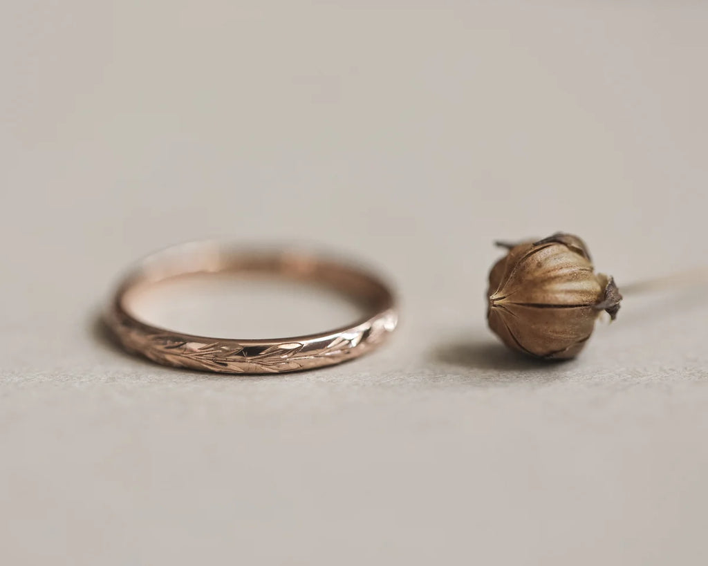 Minimal 18ct rose gold olive leaf wedding ring with botanical styling