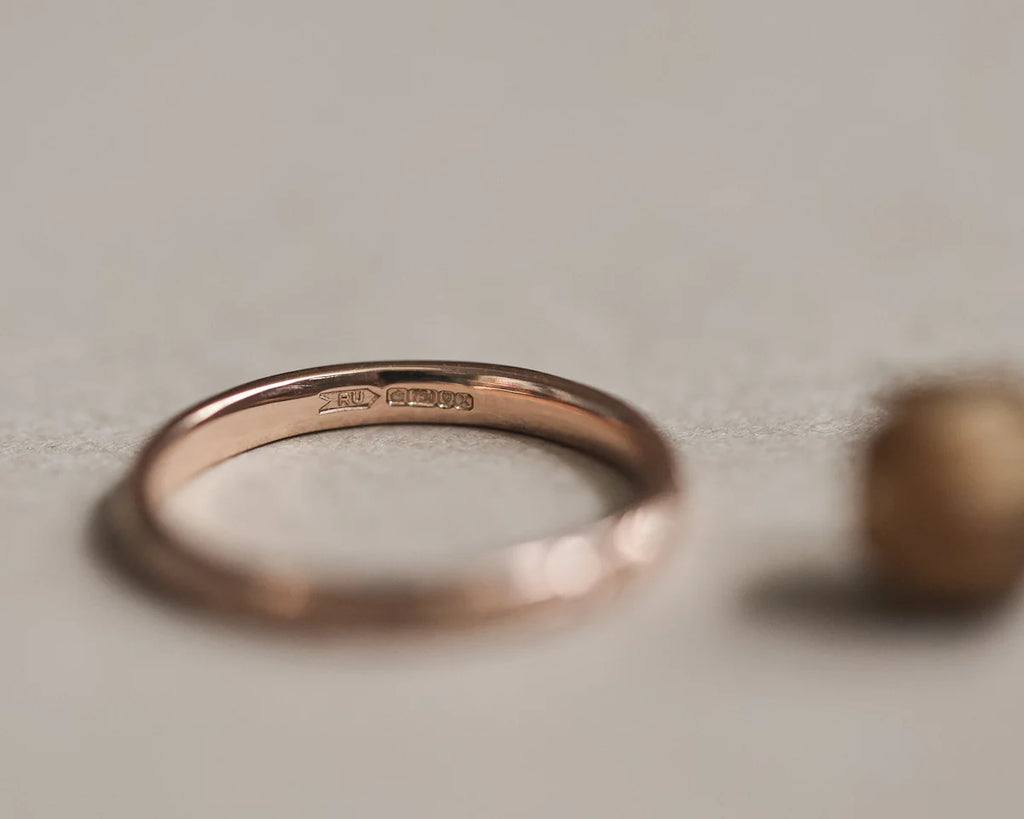 Back view of 18ct rose gold wedding ring with smooth interior